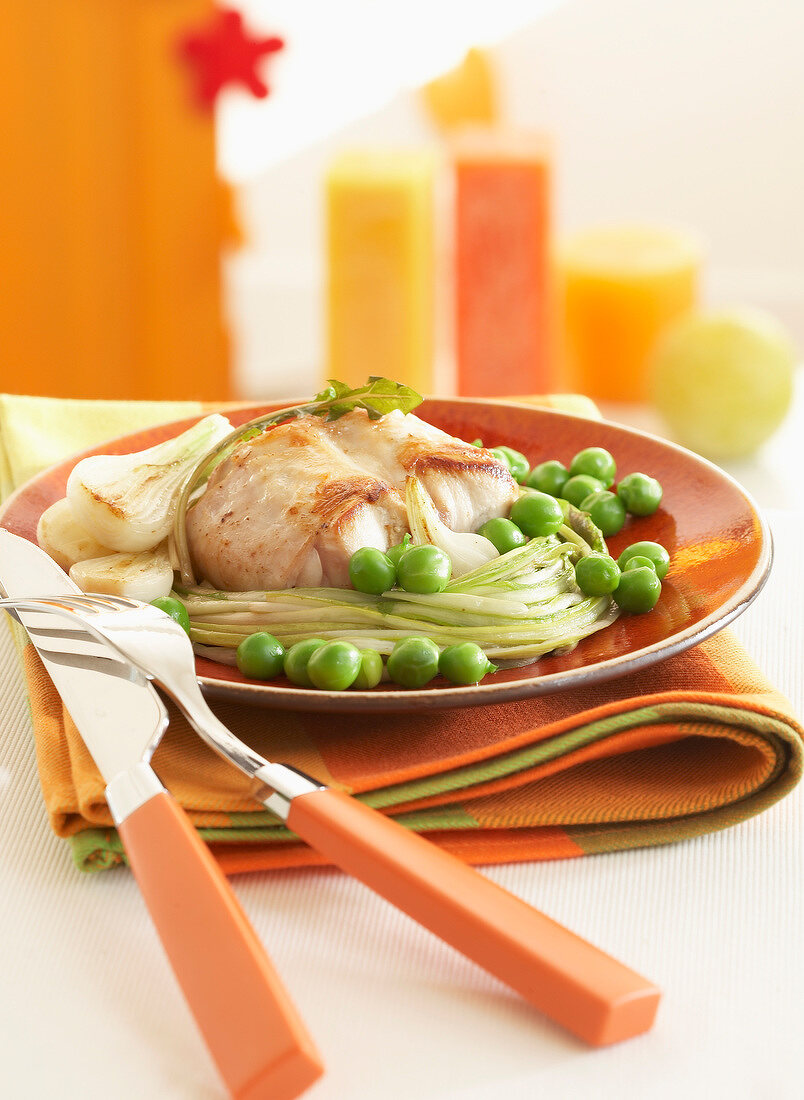 Saddle of rabbit with peas and dandelions