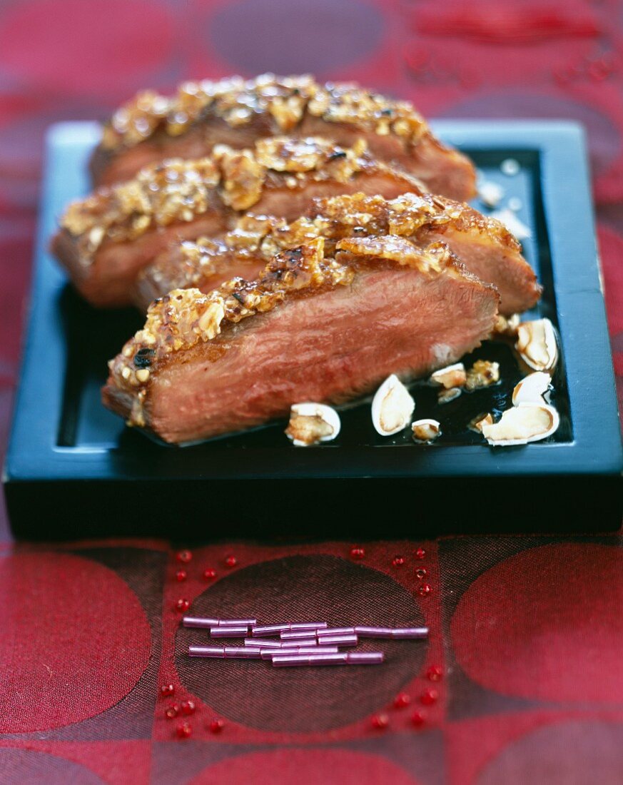 Roast duck magret with crushed sugar almonds