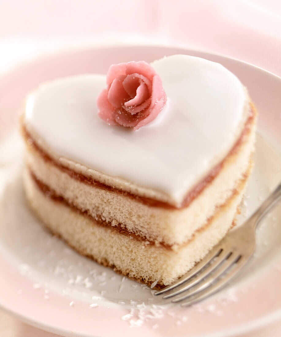 Heart-shaped sponge cake with rose-flavored jam