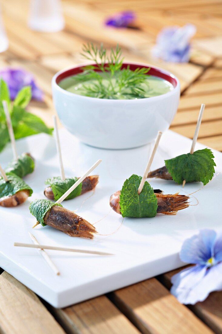 Brown shrimps wrapped in mint leaves