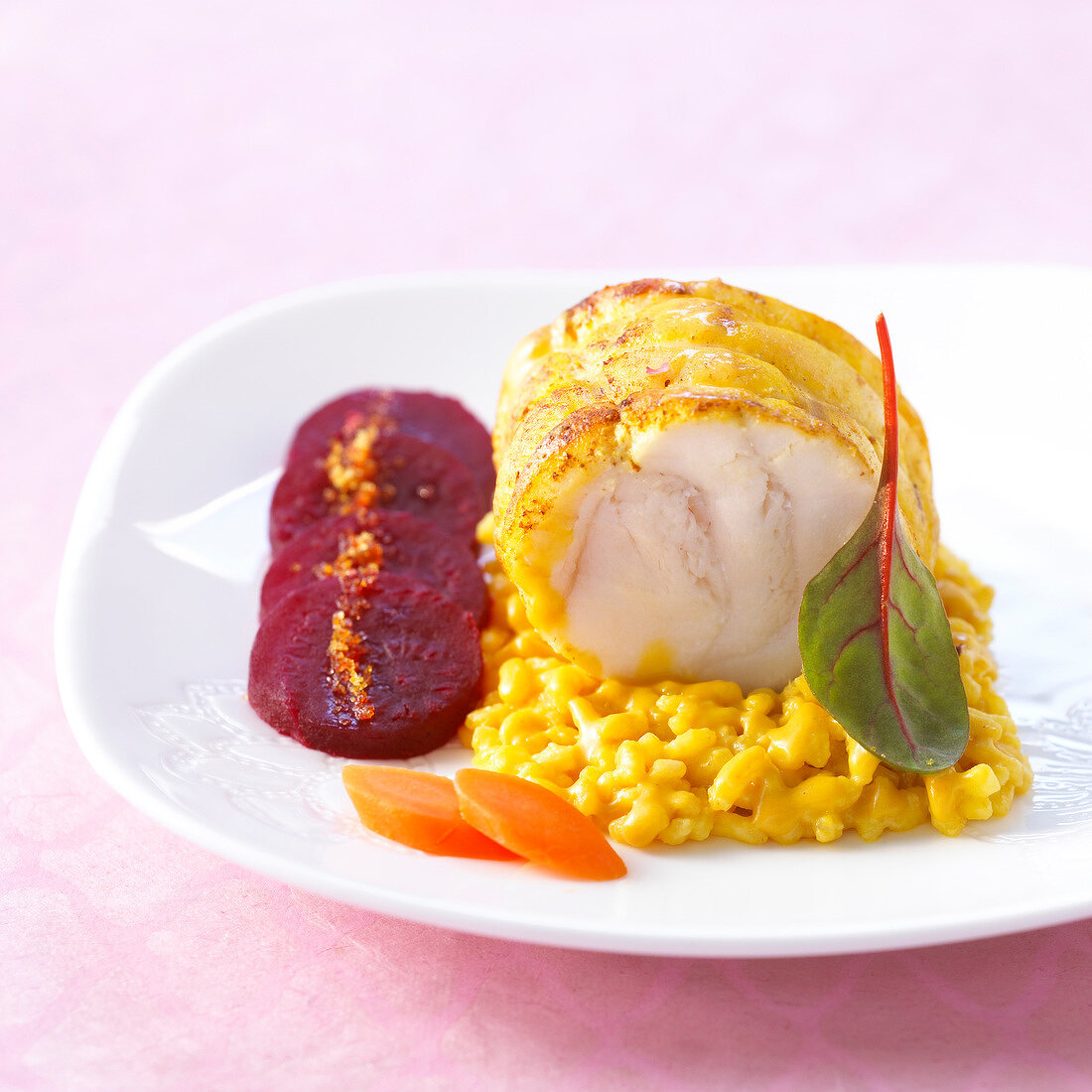 Roast monkfish on a bed of risotto and sliced beetroot