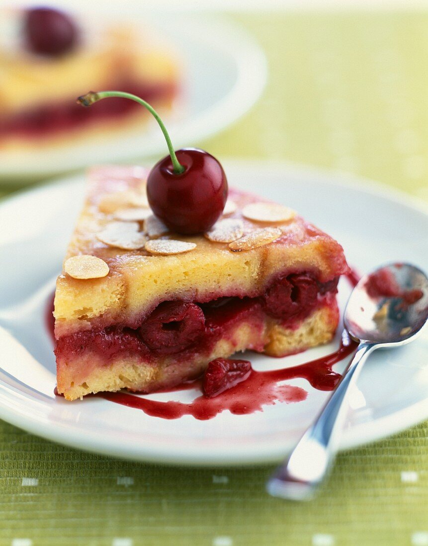 Cherry brioche-style cake topped with thinly sliced almonds