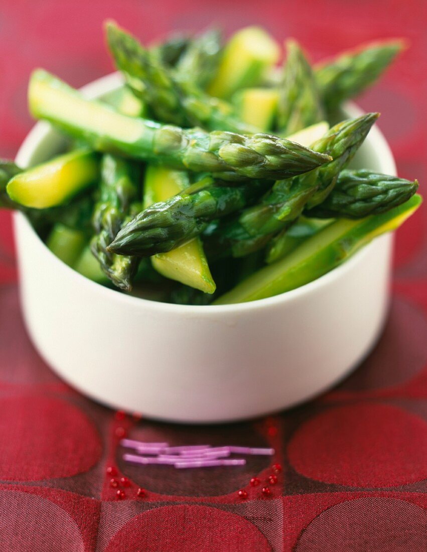 Bowl of green asparagus tops