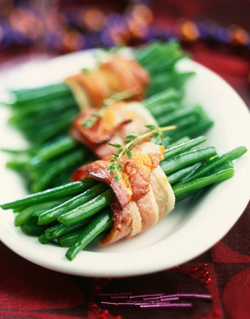 Bundles of green beans tied with strips of bacon