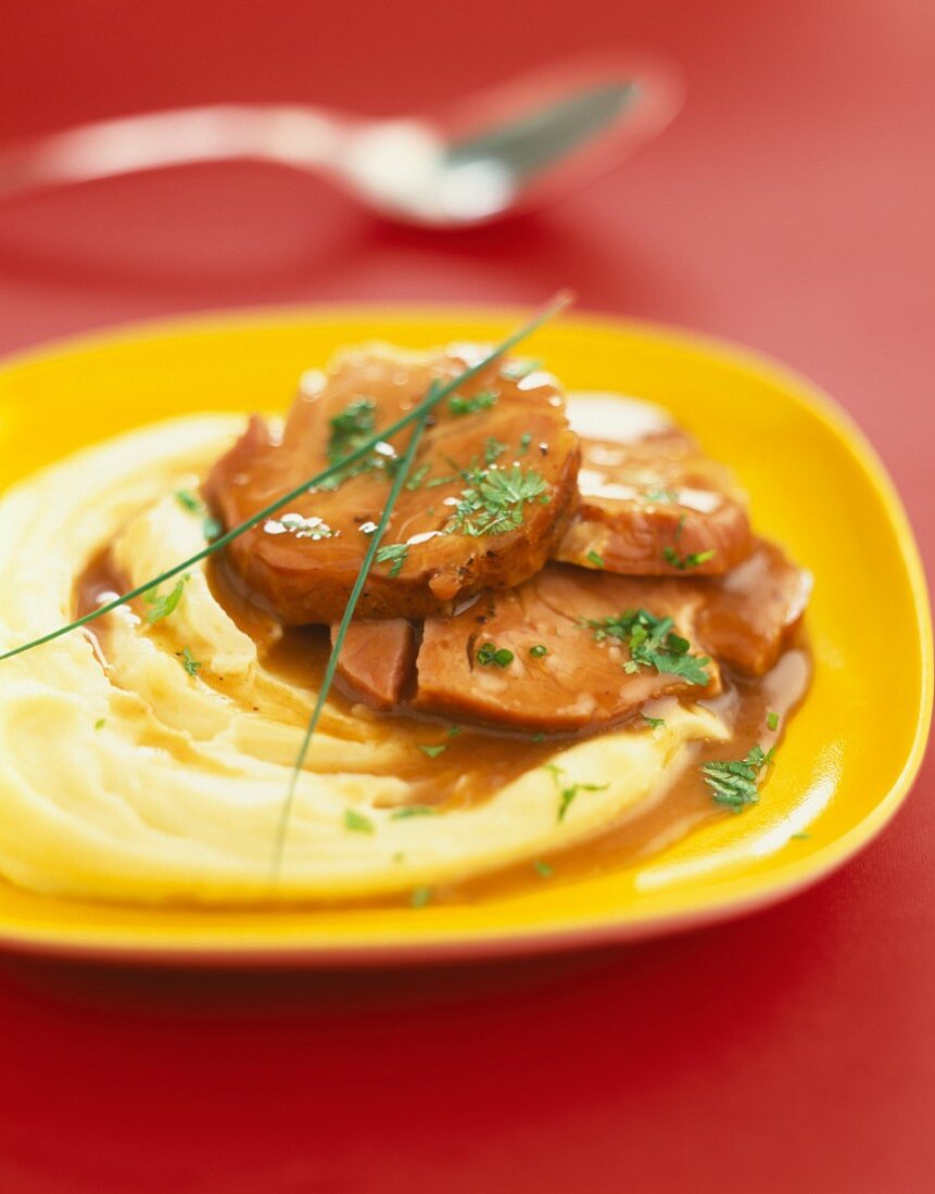 Pork with gravy and mashed potatoes