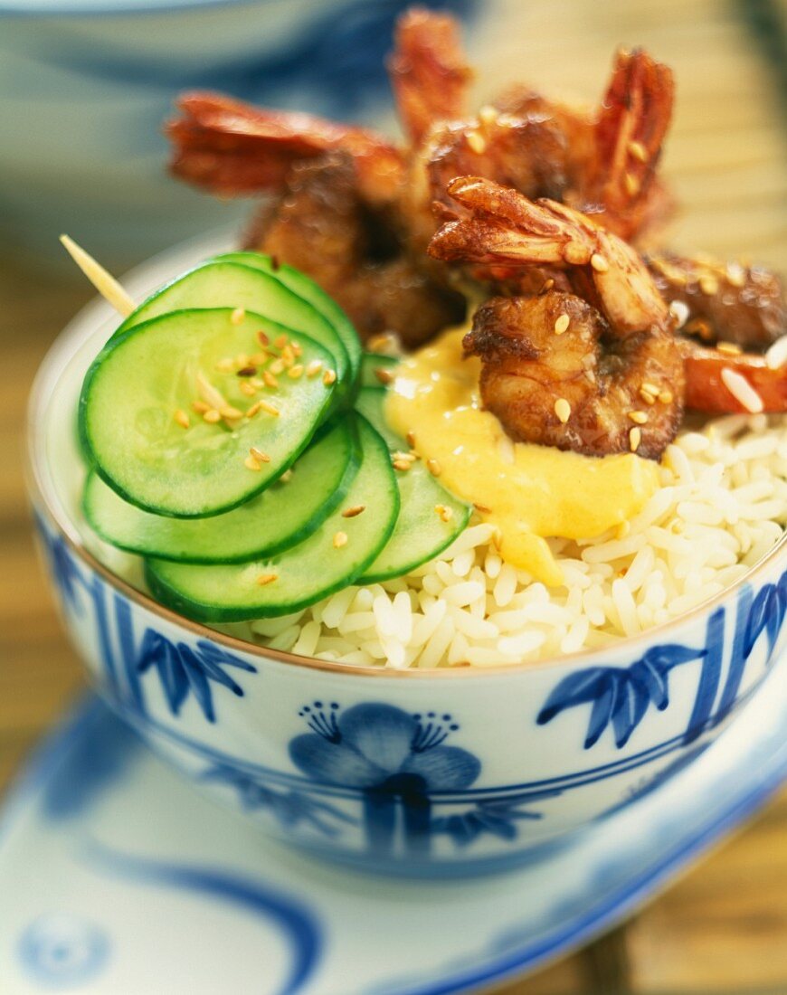 Bowl of rice with shrimps, soya sauce and sesame seeds