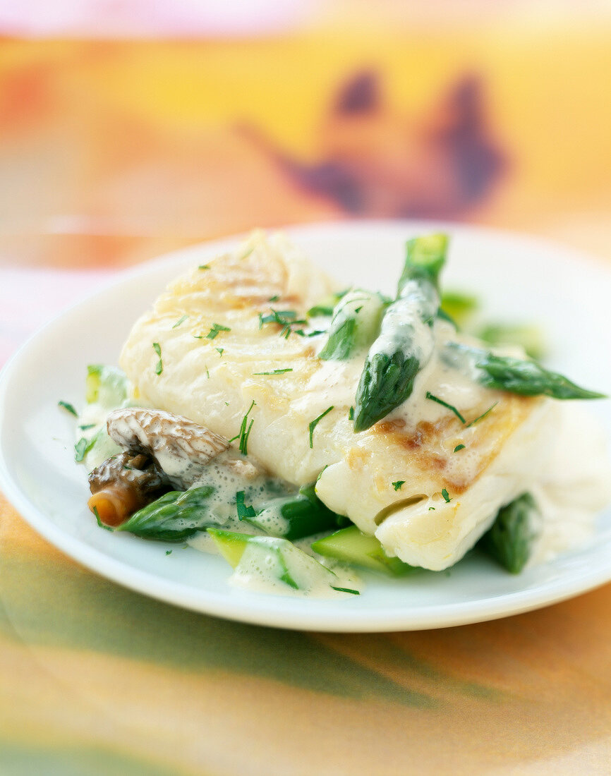 Haddock with asparagus and morels and cream sauce