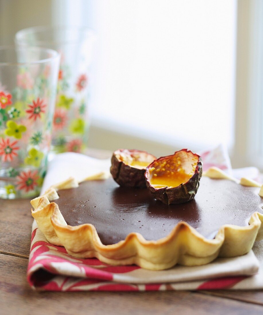 Chocolate tart with passion fruit puree