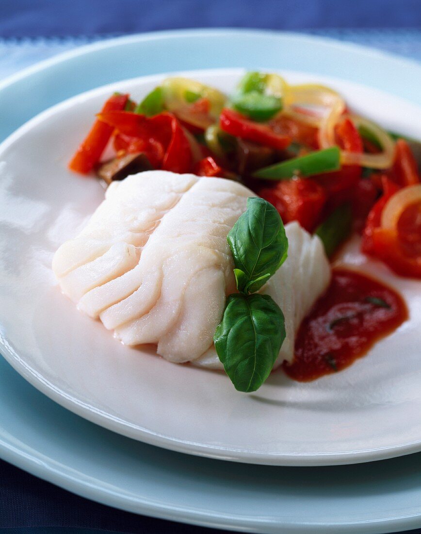 Cod with red and green peppers