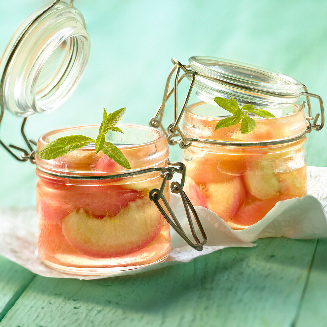 Steam-cooked peaches in verbana syrup