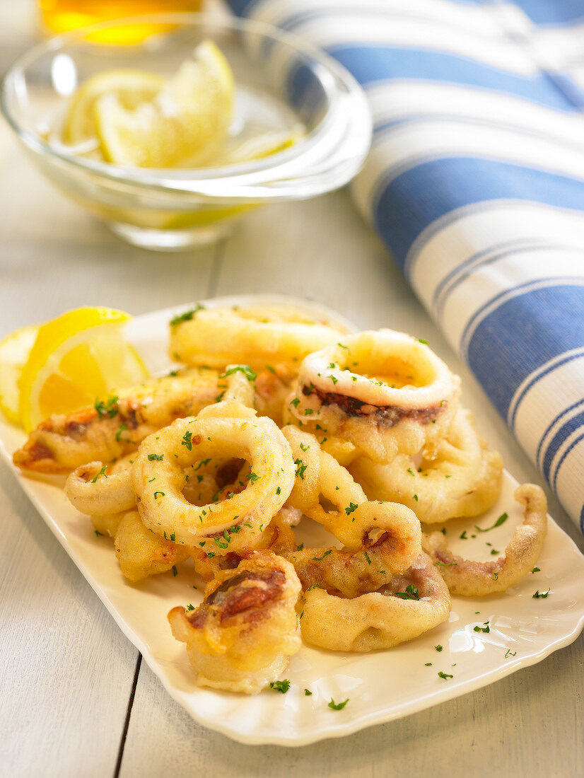 Deep-fried calamary rings with lemon and parsley