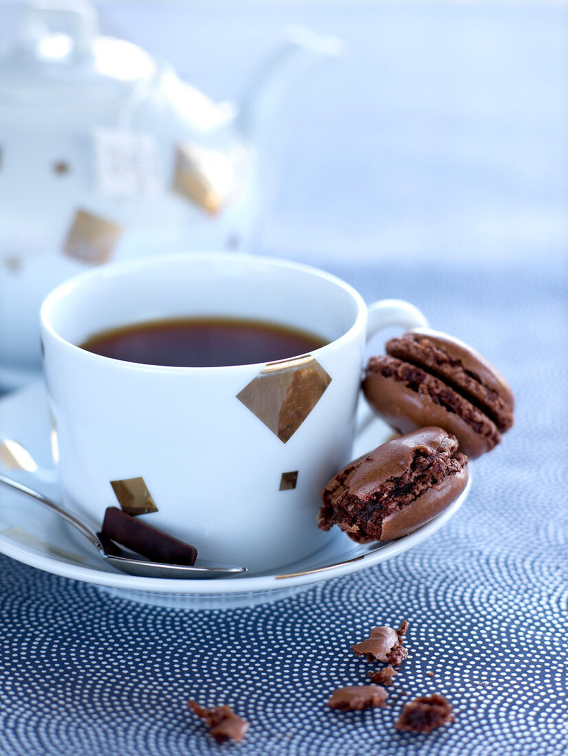 Cup of coffee and chocolate macaroons