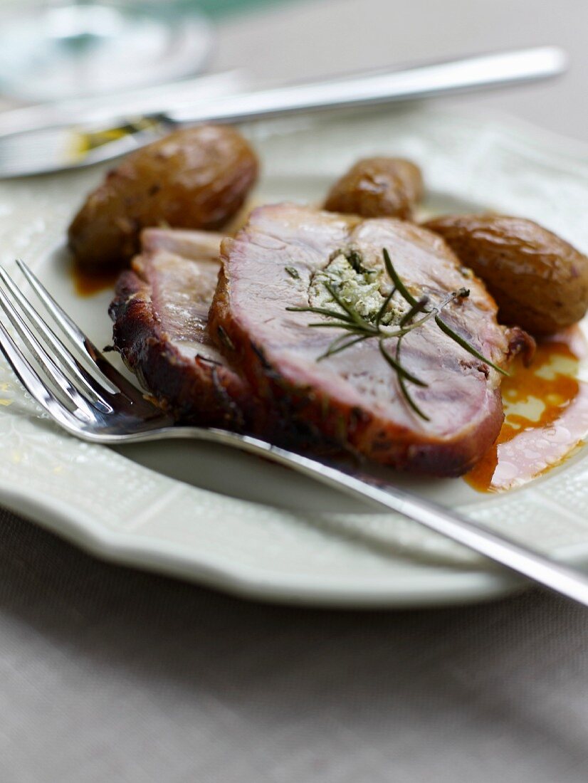 Roast pork with rosemary and roast potatoes