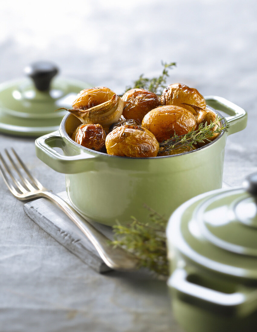 Casserole dish of Grenailles with garlic and thyme