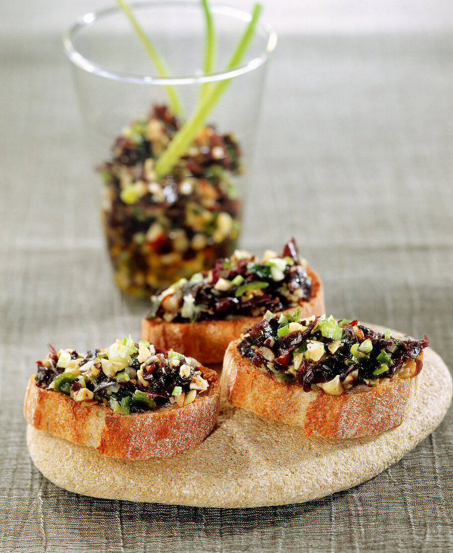 Seaweed caviar with soya oil on toasts