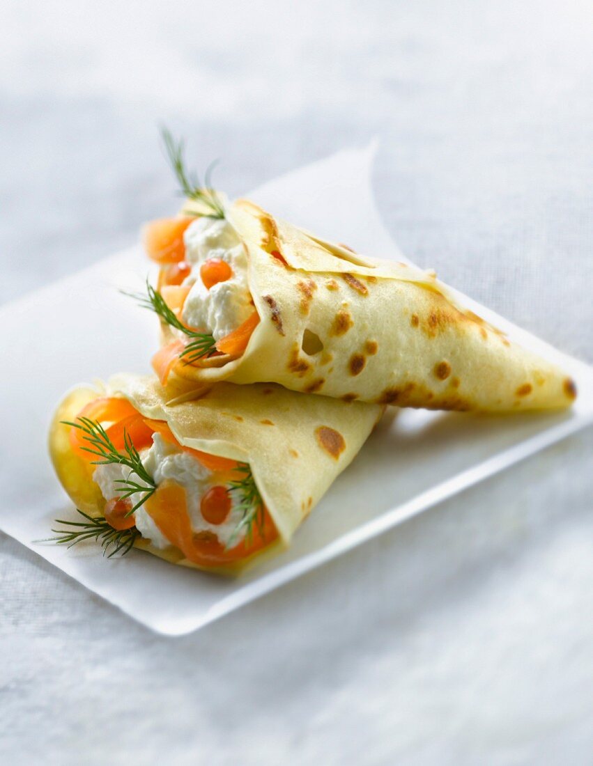 Pancake cones filled with salmon,cream and dill