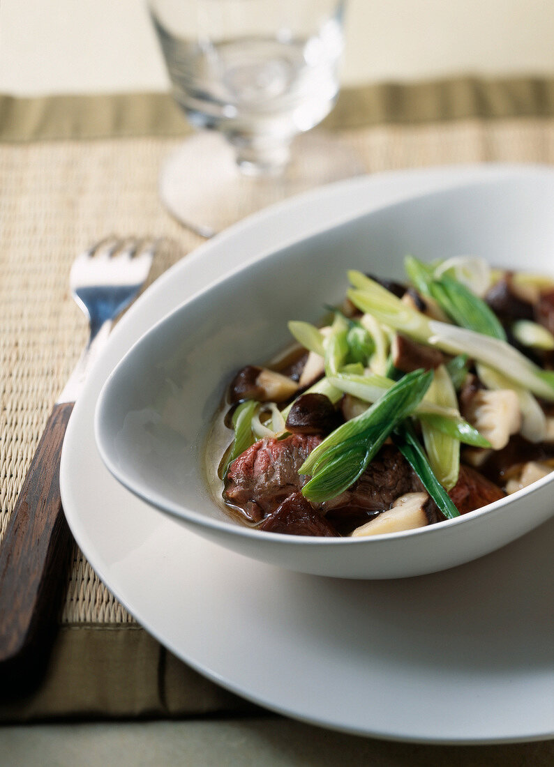 Sauteed beef with mushrooms and pak-choi