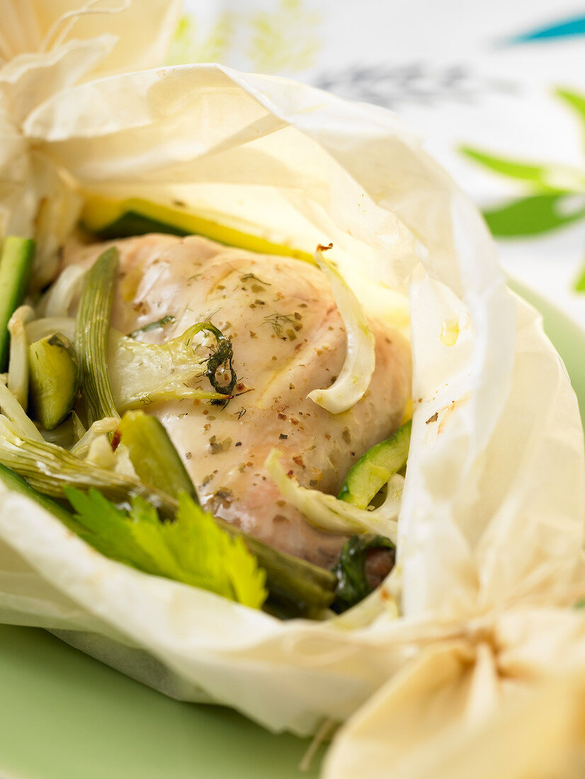 Chicken and asparagus cooked in wax paper