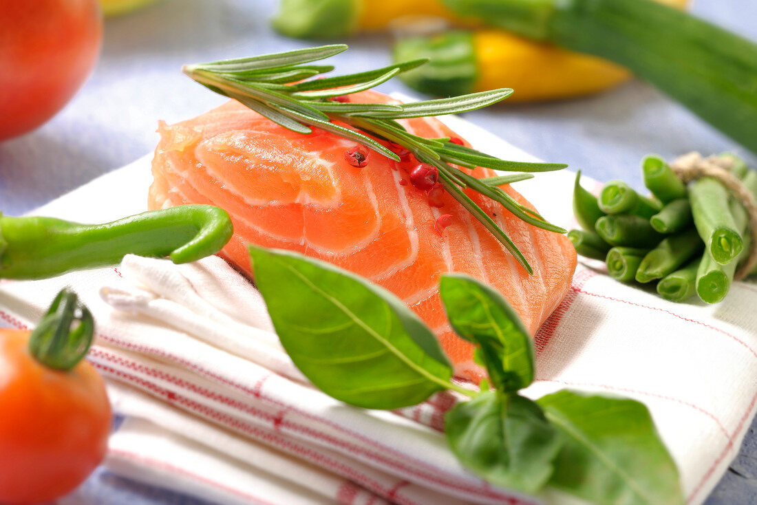 Raw salmon with vegetables and herbs