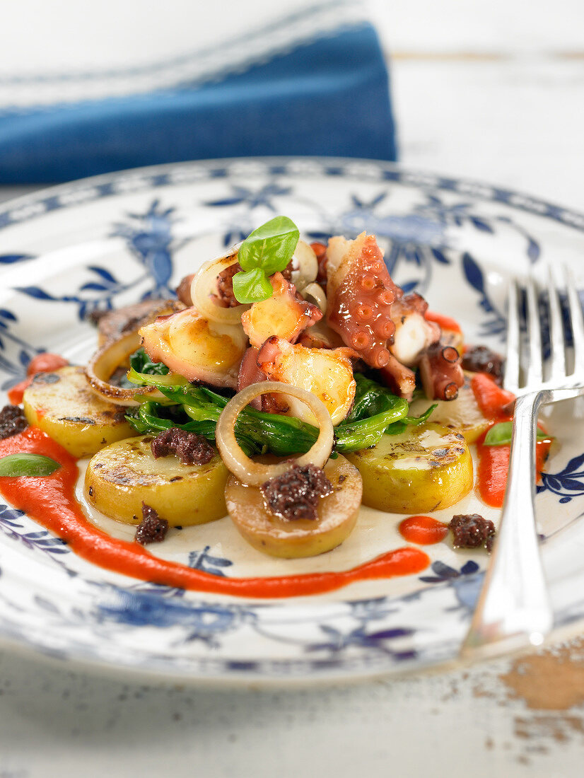 Octopus with potatoes, young turnips and red pepper puree