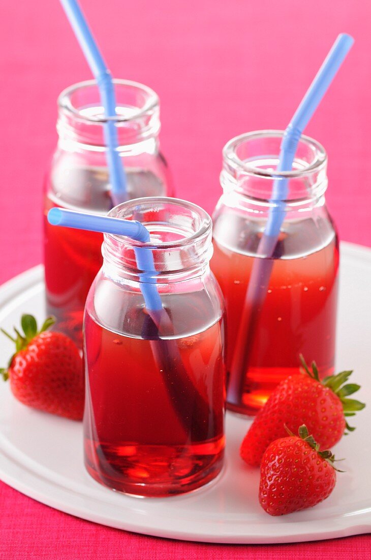 Small bottles of strawberry cordial