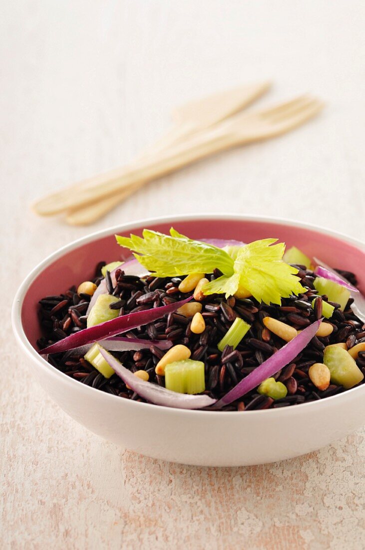 Brown and wild rice with chopped celery stalks