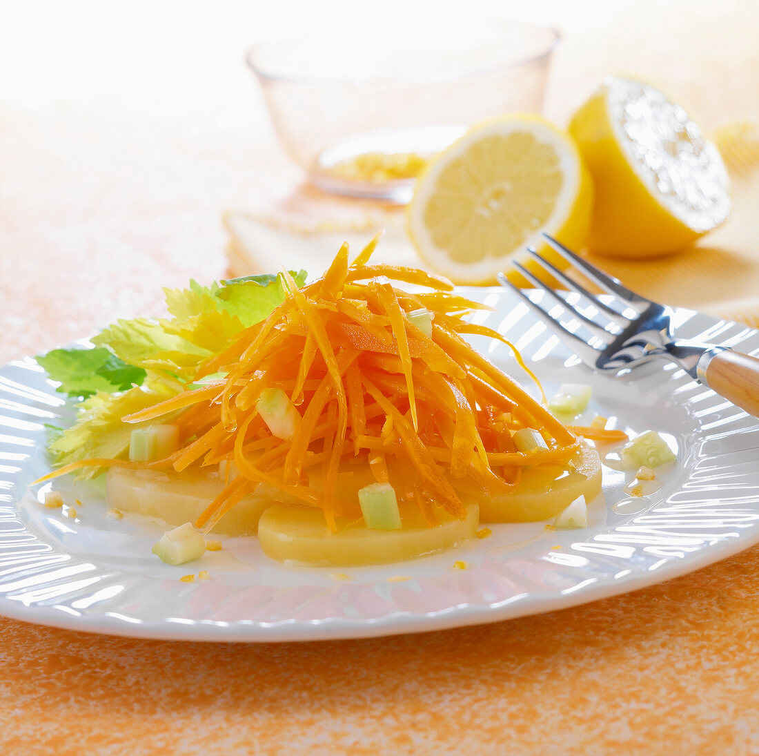 Grated carrots and potato salad with lemon juice