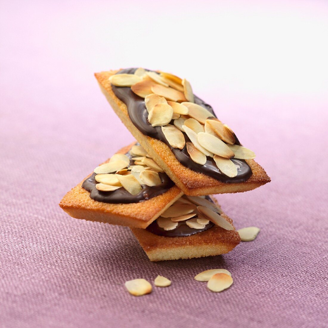 Financiers topped with chocolate and thinly sliced almonds