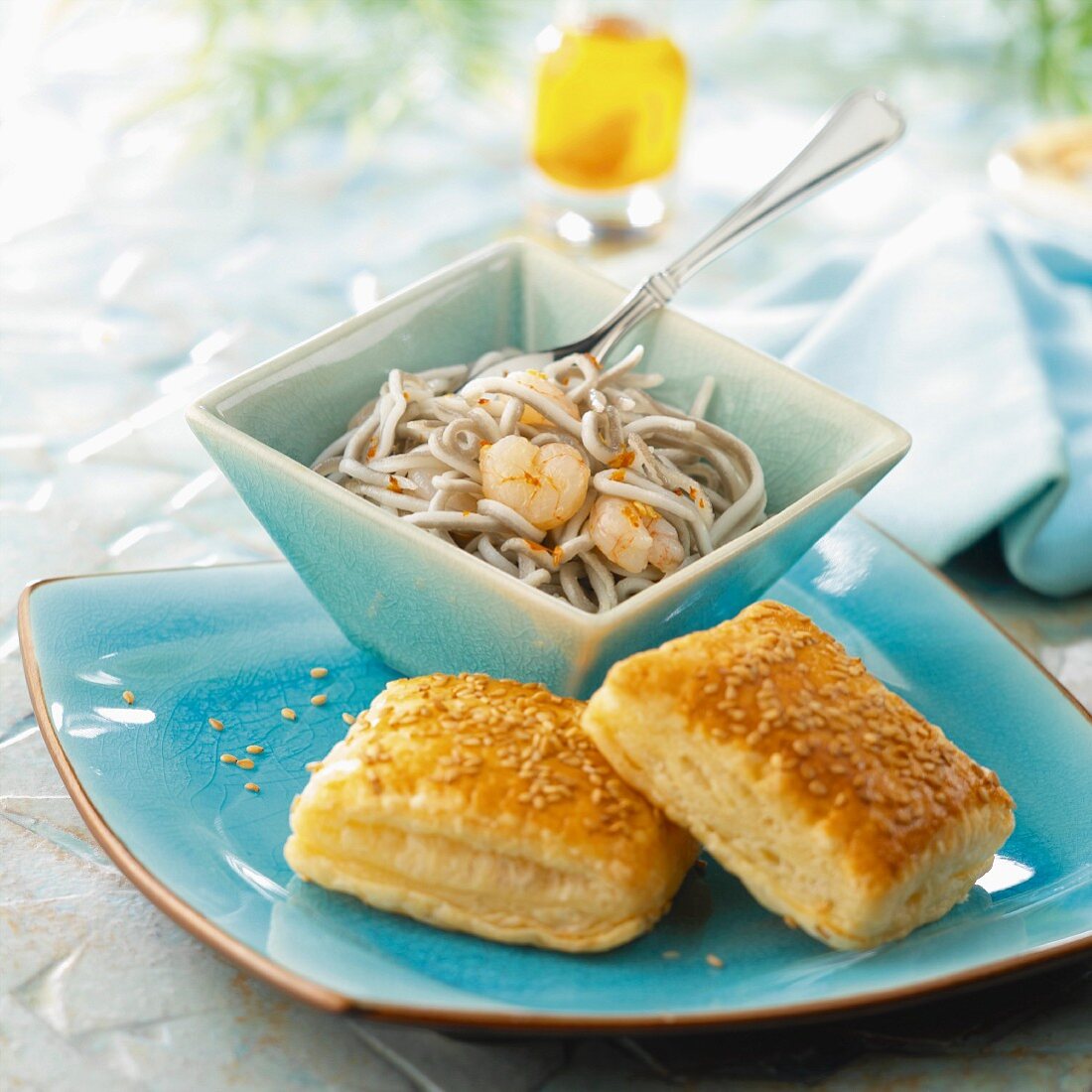Elver and shrimp salad with sesame seed flaky pastry squares