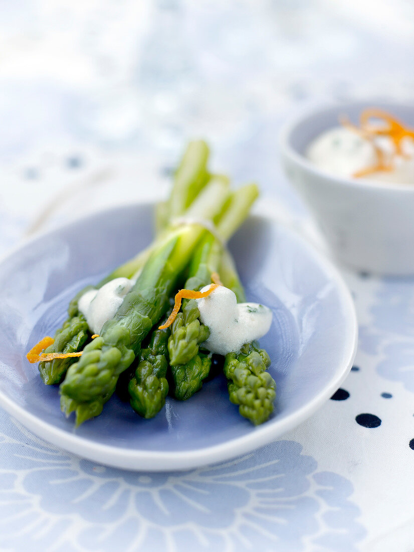 Green asparagus with lght orange emulsion