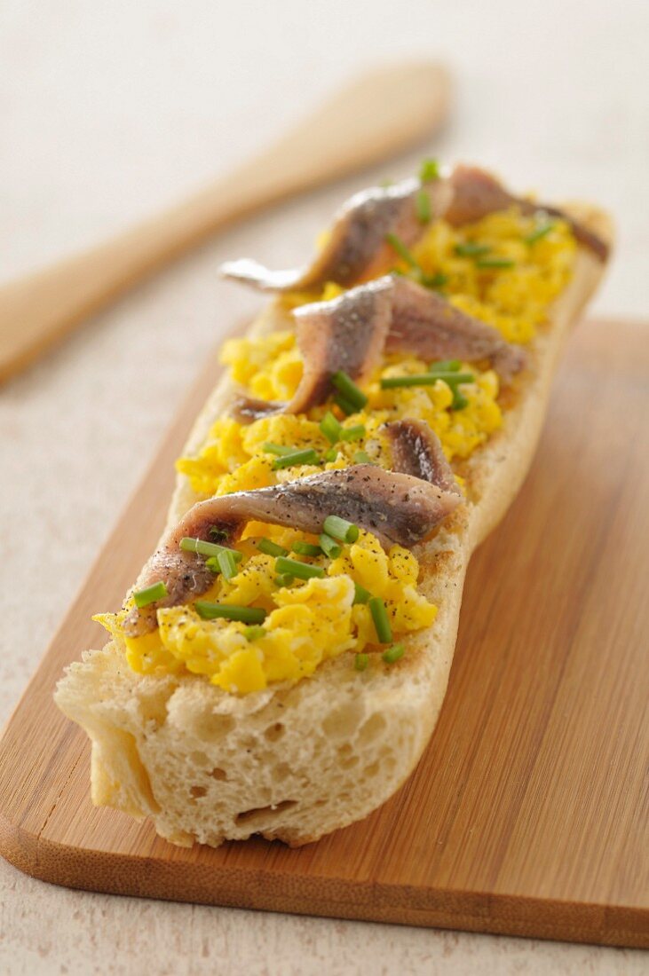 Scrambled egg and anchovy open sandwich