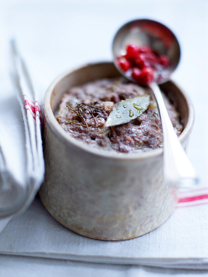 Small pot of meat terrine with redcurrants