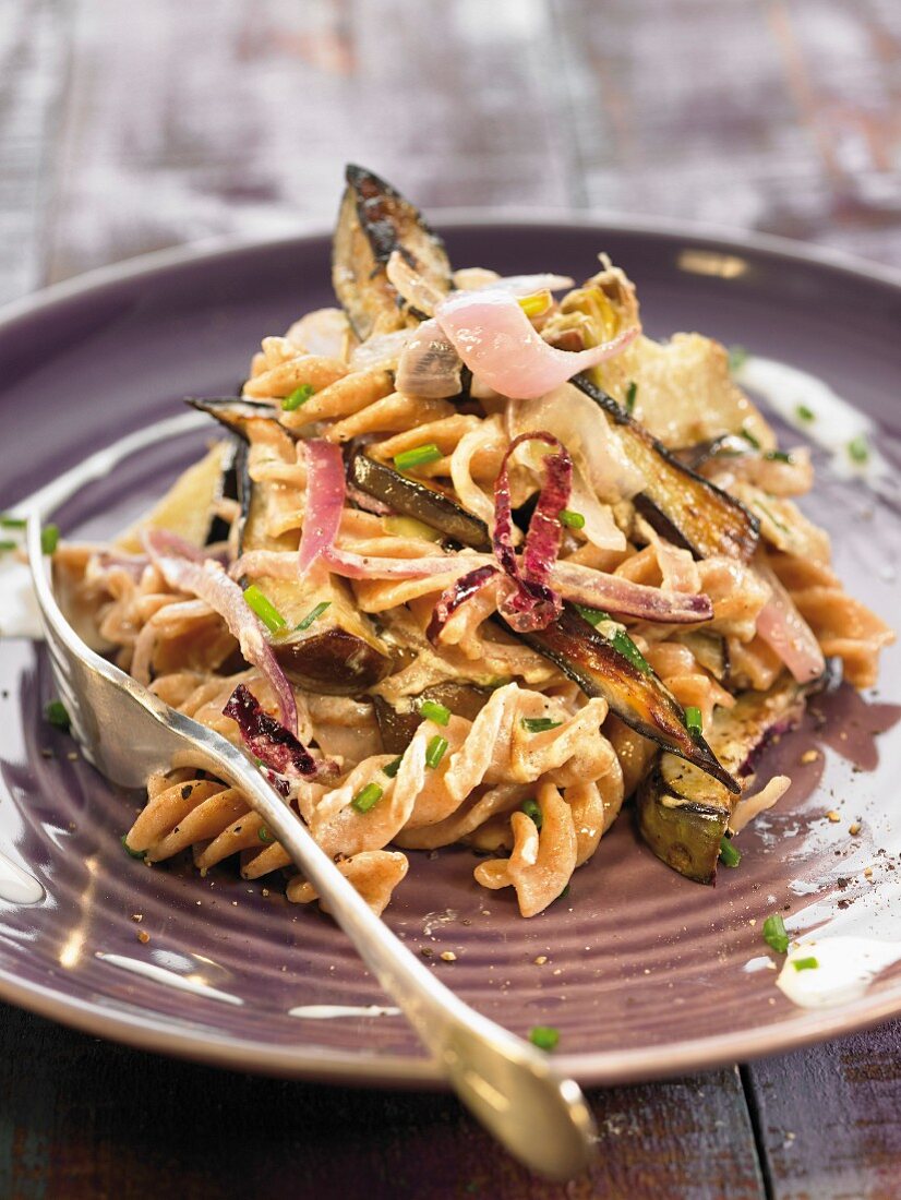 Spelt pasta sauteed with eggplants and artichokes