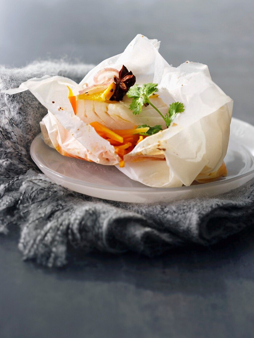 Cod and carrots cooked in wax paper