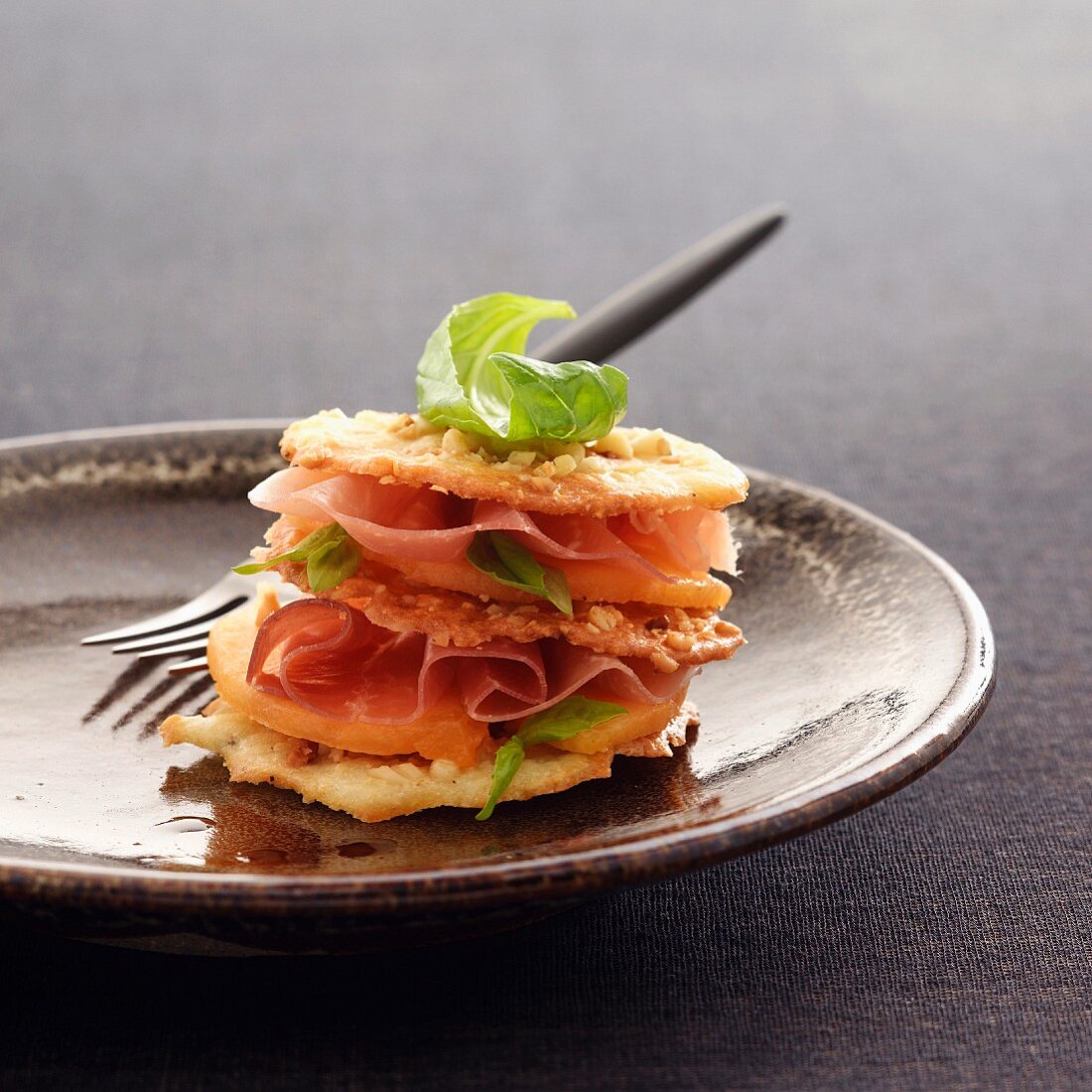 Melon and raw ham Mille-feuille with Port sauce