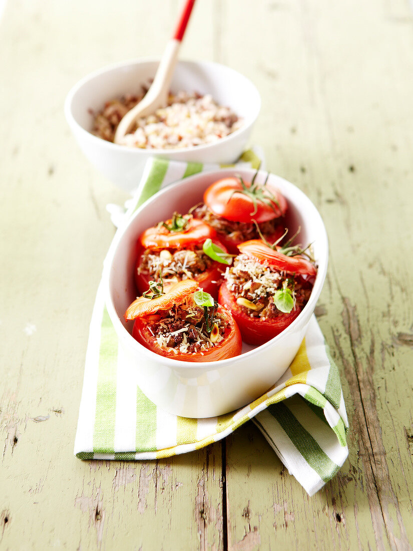 Tomatoes stuffed with two types of meat and wild rice