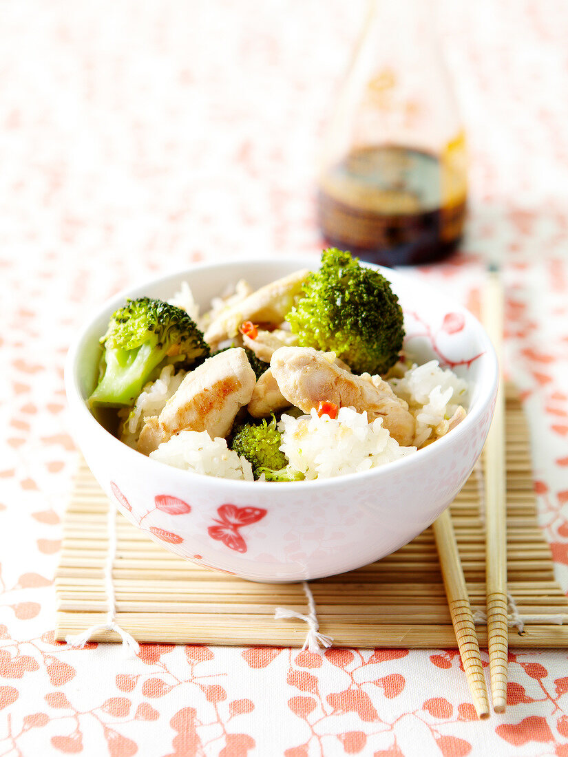 White rice,broccoli and chicken cooked in a wok