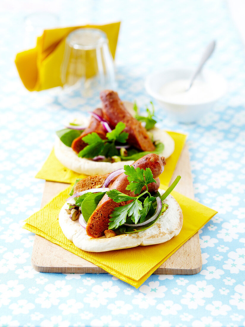 Pitta bread with sausage and herbs