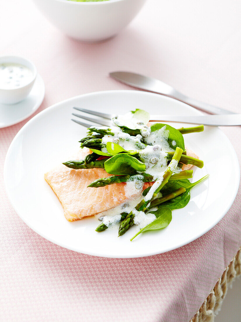 Salmon fillet with asparagus,spinach and caper sauce
