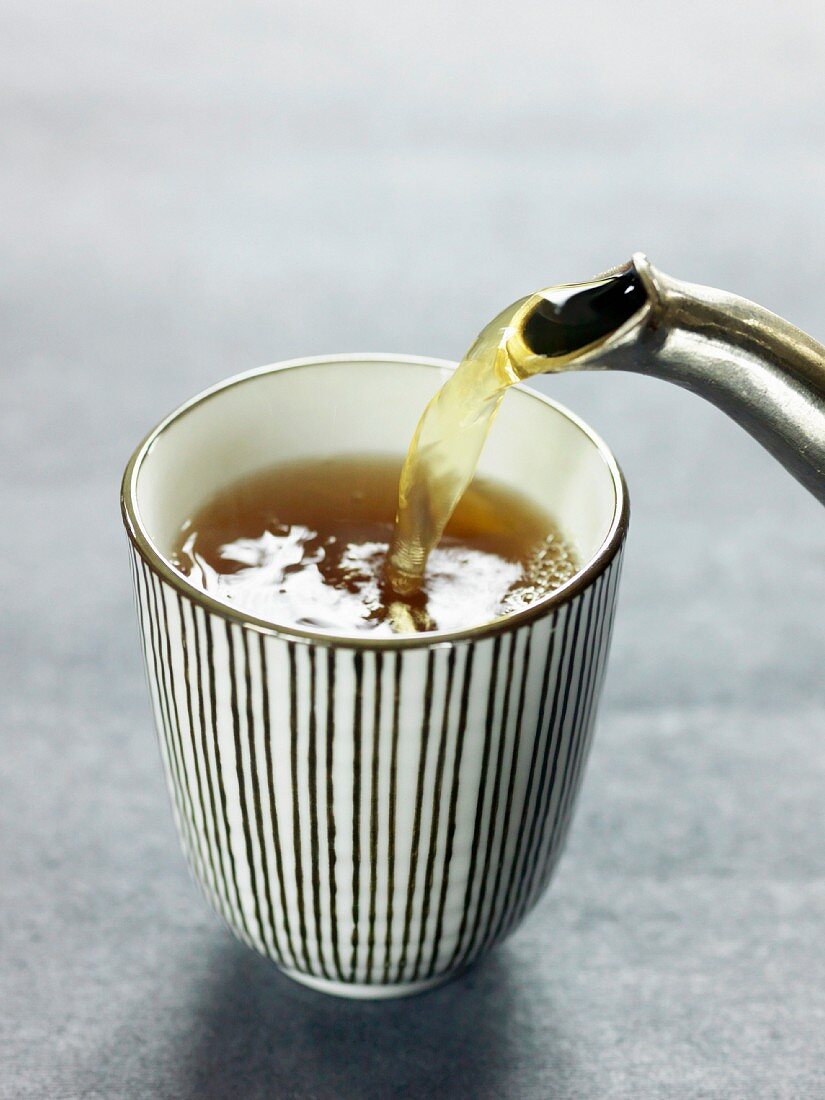 Pouring green tea