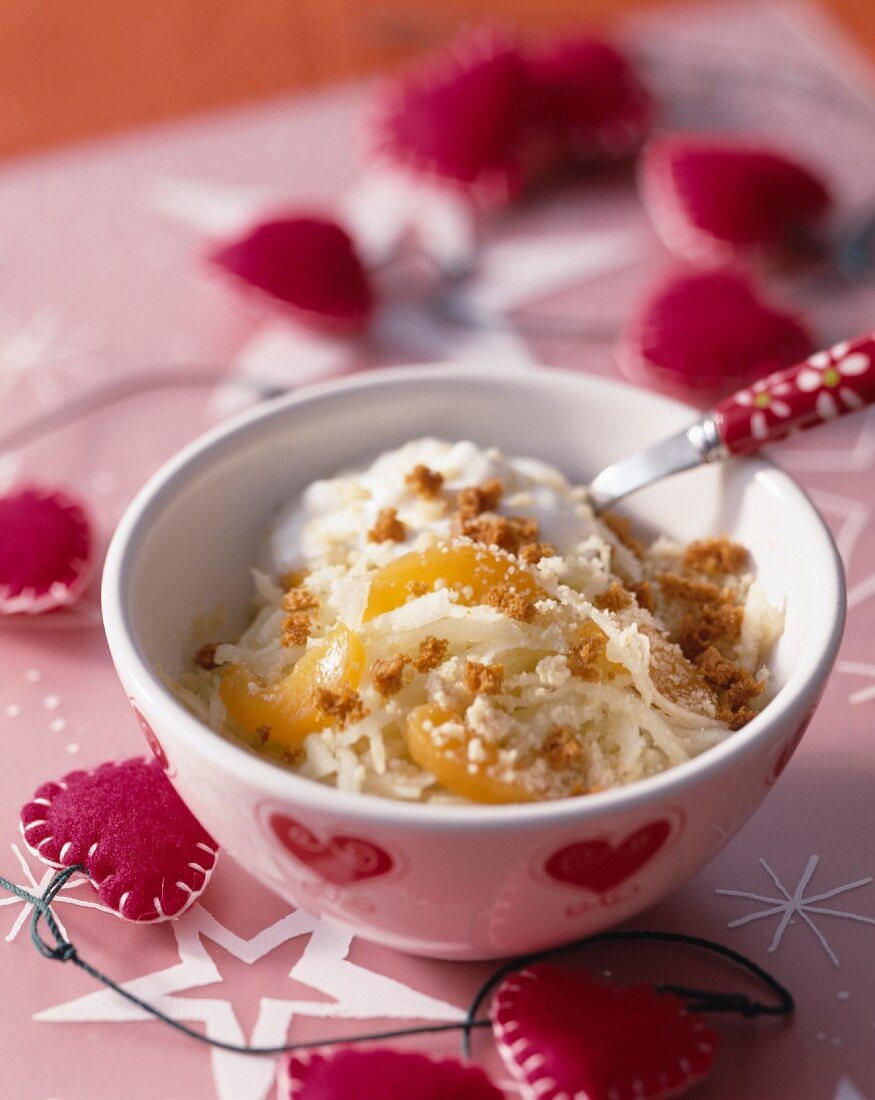 Pear and apricot fruit salad with crumbled gingerbread