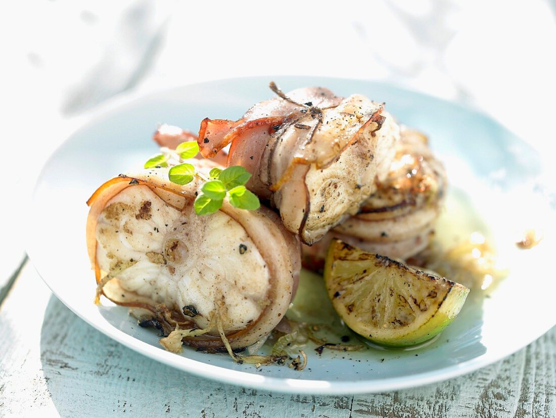 Monkfish wrapped in bacon with lemon