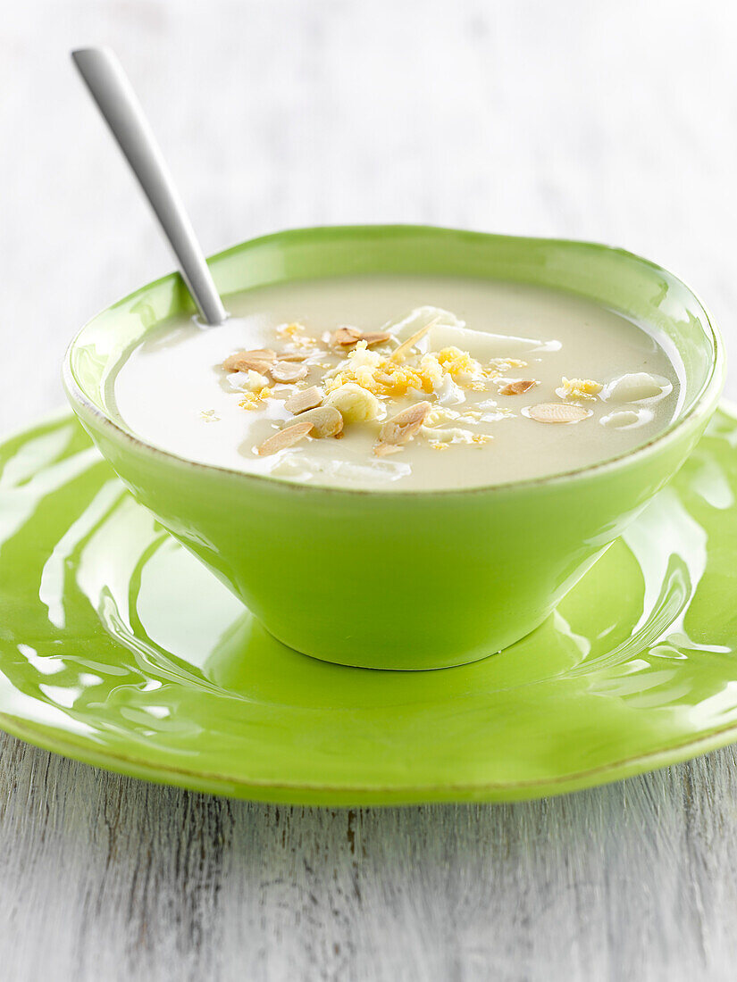 White asparagus soup with almonds and hard-boiled egg