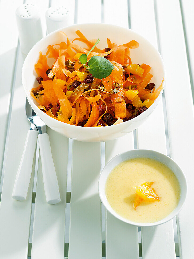 Carrot and dried fruit salad with yoghurt and orange sauce