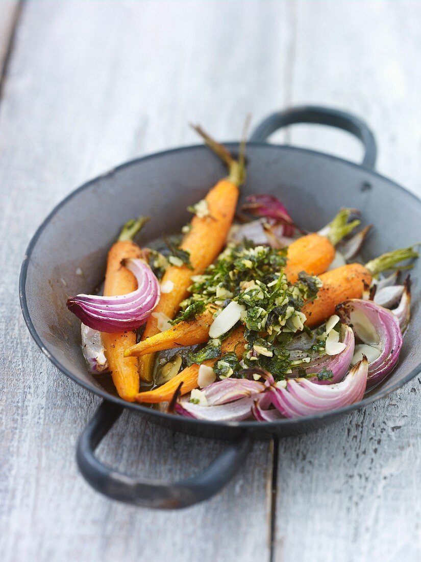 Roast carrots and red onions with herbs