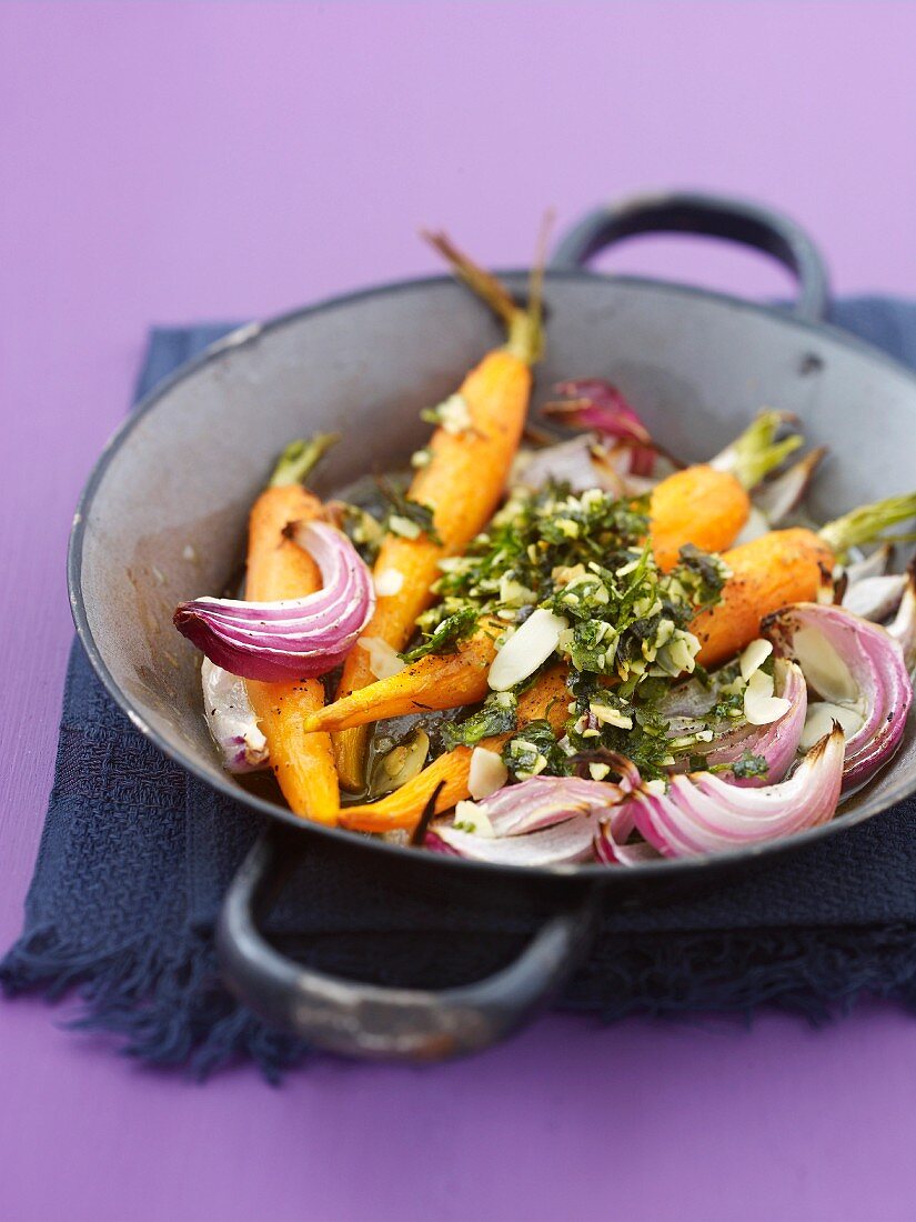 Roast carrots and red onions with herbs