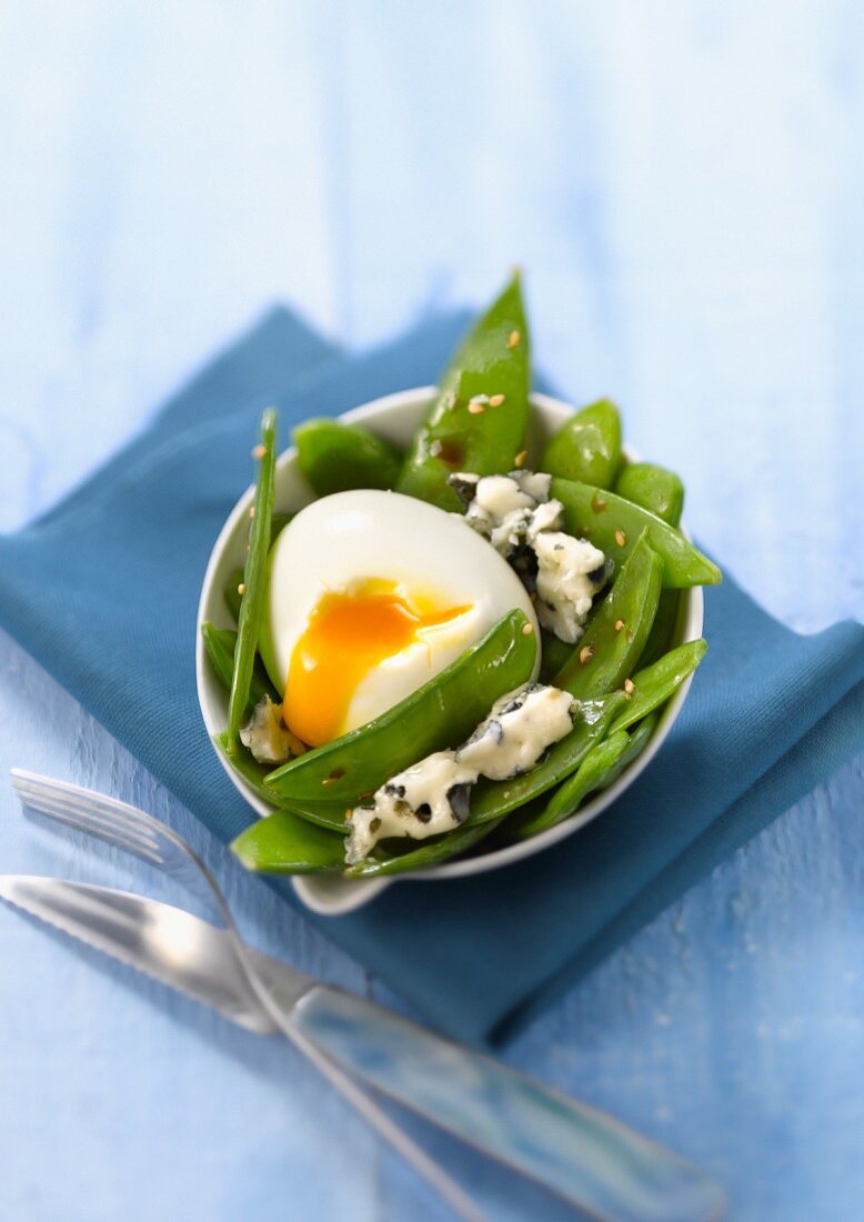 Sugar pea salad with Roquefort and soft-boiled egg