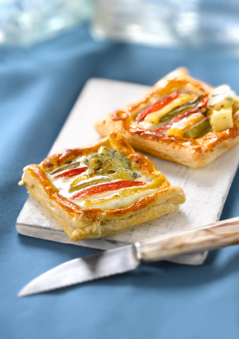 Red,yellow and green pepper and Fourme de Montbrison tartlet