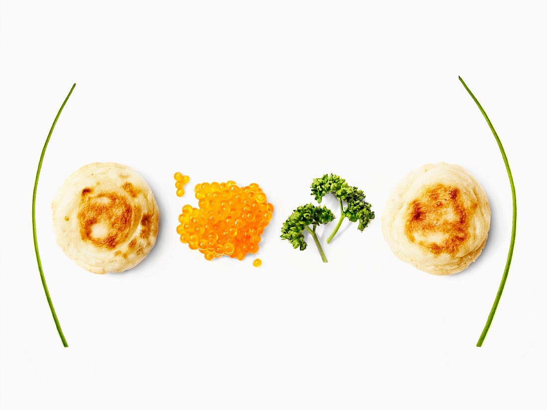Blinis, salmon roe and parsley equation