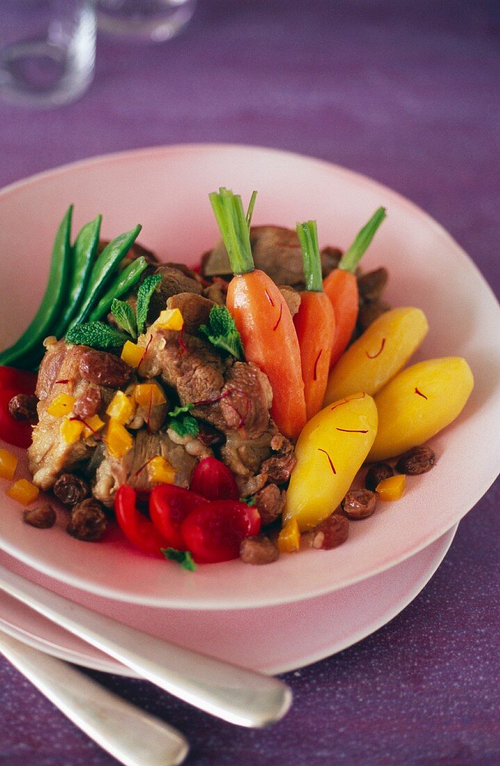 Lamb, saffron, vegetable and raisin Tajine